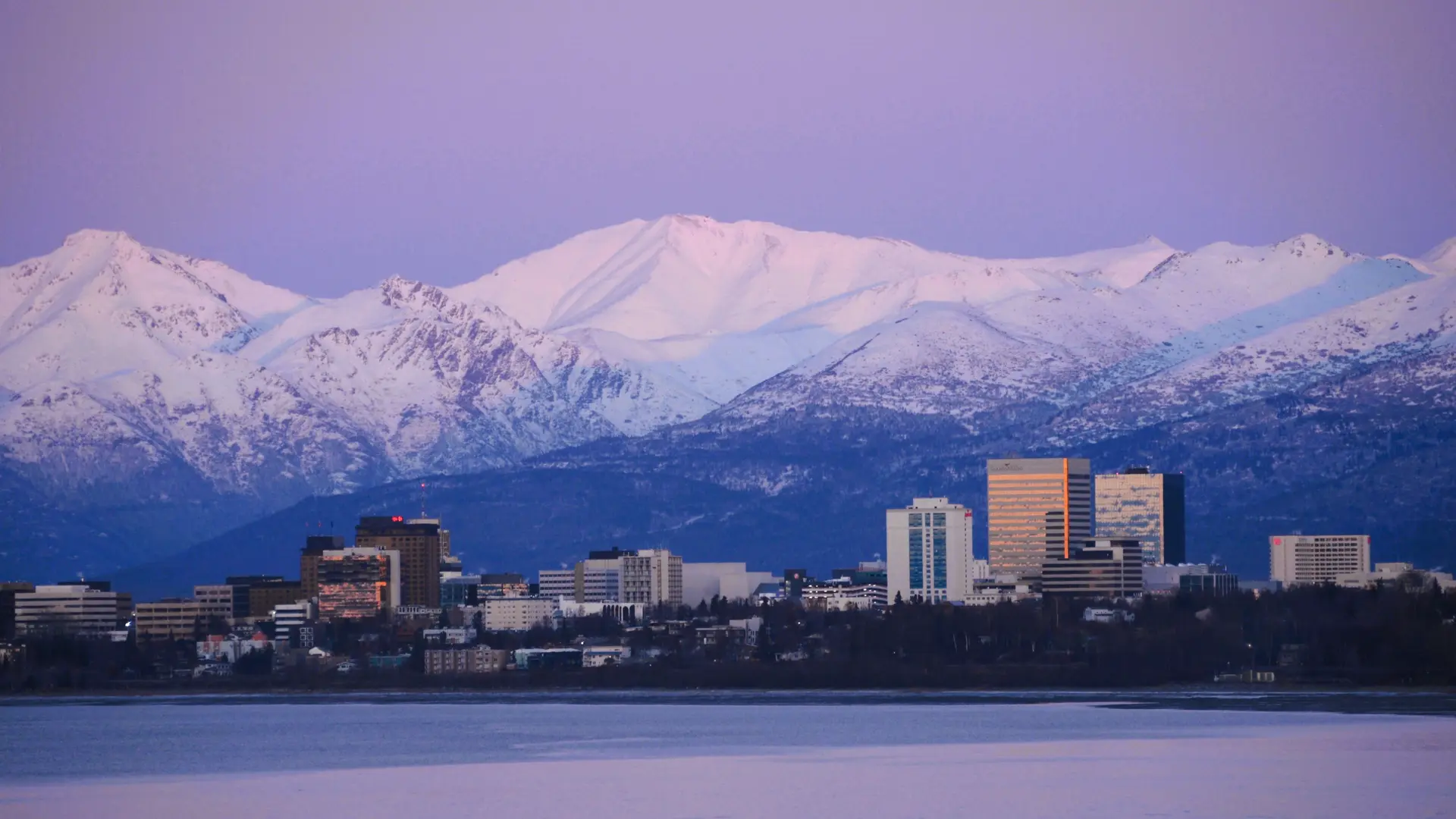 Anchorage skyline and Chugach Mountains at sunset